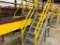 Steel steps over belt conveyors w/ platforms.