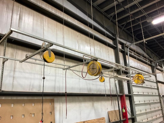 Overhead apparatus w/2 hose reels & 2 cord reels.