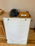 Projector; paper cutter white board.