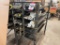 Steel stock rack; 28 in x 56 in; w/ assorted round stock, stainless steel & aluminum, plastic, and