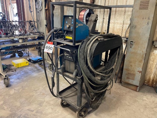 Miller XMT 450 CC/CV welder w/ Miller 75 Series 24 volt wire feeder; 50 ft feeder extension & cart.