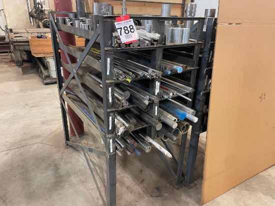 Steel stock rack; 28 in x 56 in; w/ assorted round stock, steel & aluminum cut-offs.