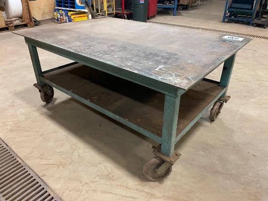 Steel table on casters; 48 in x 72 in x 3/8 in.
