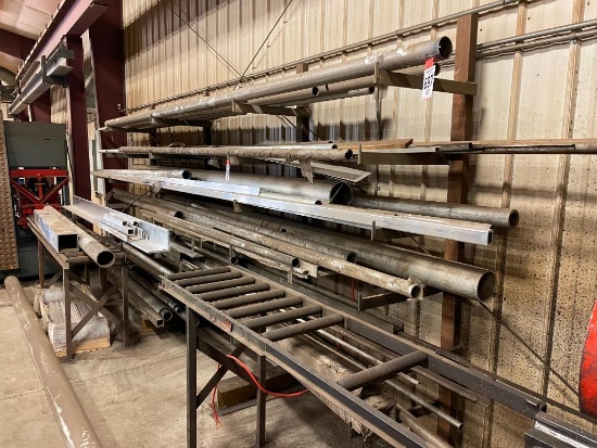 Steel stock material rack, 14 ft long, 7 - 20 in shelves.