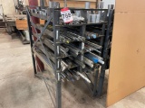 Steel stock rack; 28 in x 56 in; w/ assorted round stock, steel & aluminum cut-offs.