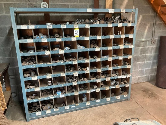 Steel bin w/ assorted pipe fittings.