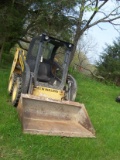 New Holland Skid loader Model # L215 with bucket and tooth bar, does run