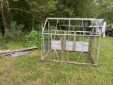 greenhouse frame with glass panels and tin roofing