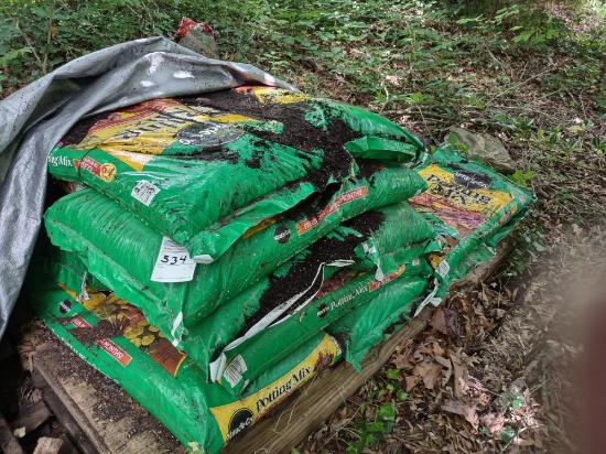 Numerous bags of potting soil