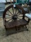 Rustic Bench With Wagon Wheel as Back