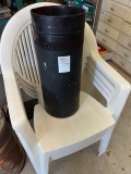 antique trash can and 4 plastic chairs