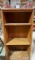 Bookshelf and 7 glasses appears to be Christmas glasses