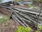 Large piles of rough sawn lumber and tin all one money