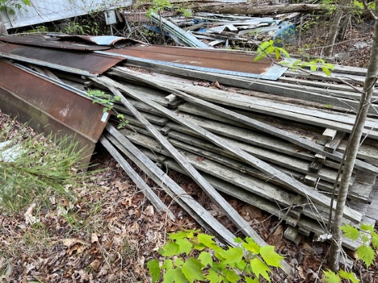 Large piles of rough sawn lumber and tin all one money