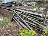 Large piles of rough sawn lumber and tin all one money