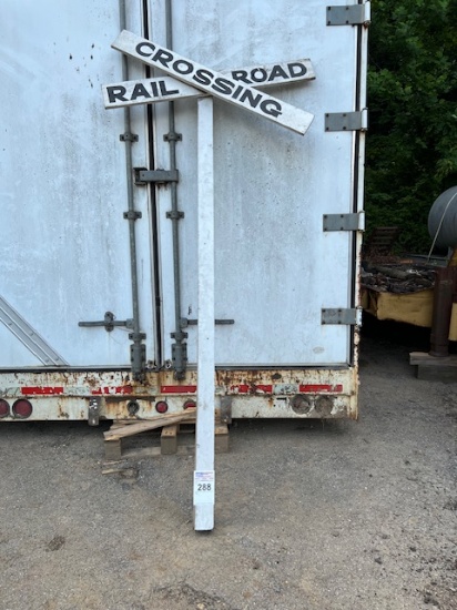 railroad crossing wood pole and sign