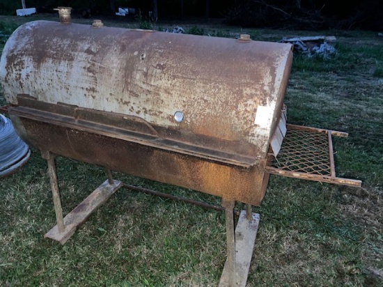 hog smoker , large made of a drum , bottom has some holes