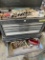 black Stanley toolbox top and bottom with contents