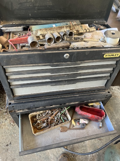 black Stanley toolbox top and bottom with contents