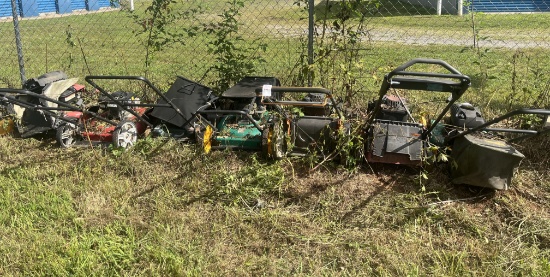 pile of push mowers