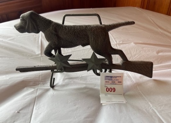 Hunting Dog standing on rifle and a plate holder