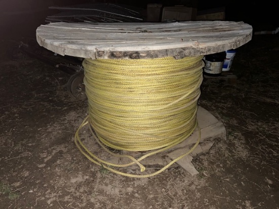 large spool of yellow lineman rope