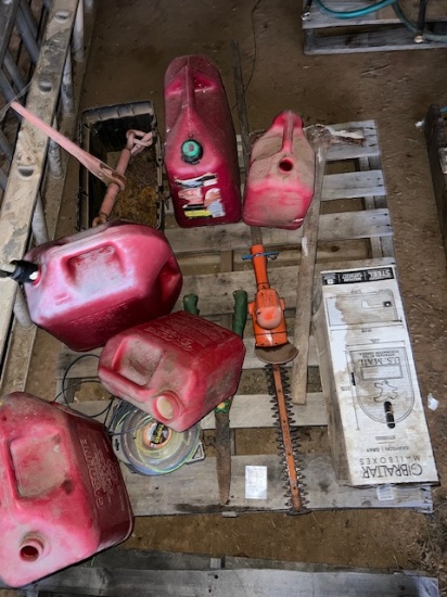 pallet of gas cans , hedge trimmers. Mail box