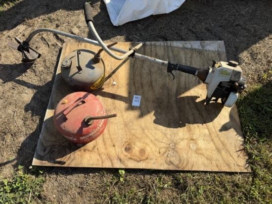 weedeater with blade and 2 old 2 gal gas cans