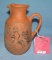 Hand painted earthenware pitcher