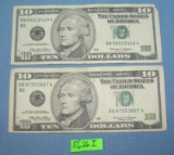Pair of old style US ten dollar bills