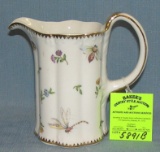 Vintage insect and flower decorated water pitcher