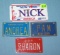 Group of souvenir metal license plates