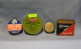Group of four vintage tin pellet containers