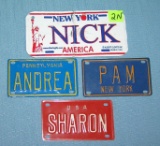 Group of souvenir metal license plates
