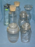 Collection of vintage glass covered storage jars
