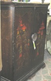 Antique television set in oriental themed cabinet