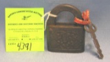 Antique cast iron padlock with key