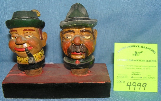 Pair of antique figural liquor bottle stoppers