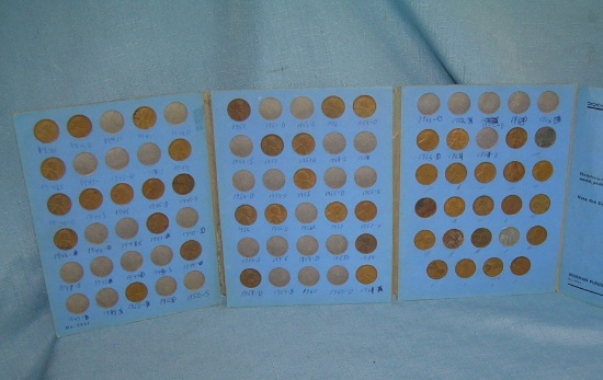 Group of vintage Lincoln pennies in collector's book
