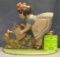 Hand painted cast iron girl watering flowers door stop