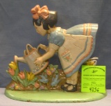 Hand painted cast iron girl watering flowers door stop