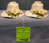 Pair of floral decorated ladies bonnet shaped candle stick
