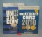 Pair of coin collecting books with prices