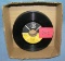 Box of vintage 45 RPM records