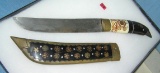 Antique dagger made of bone, brass, walnut and steel