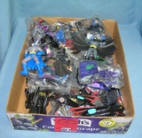 Box full of vintage Batman collectible toys