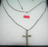 Silver tone religious necklace featuring Jesus on the cross