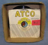 Box of vintage 45 RPM records