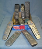 Box full of TV and DVD remote controls