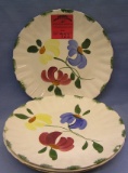 Group of four floral decorated serving plates